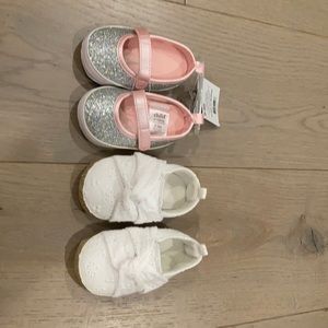 Baby girl shoes. One pair 0-3 months the other 3-6 month.